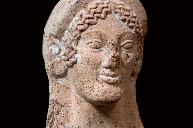 Testa votiva femminile in terracotta