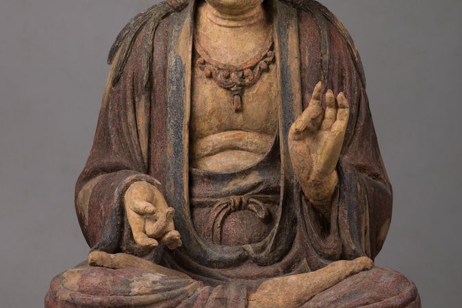 Bodhisattva assiso in vitarkamudrā inversa