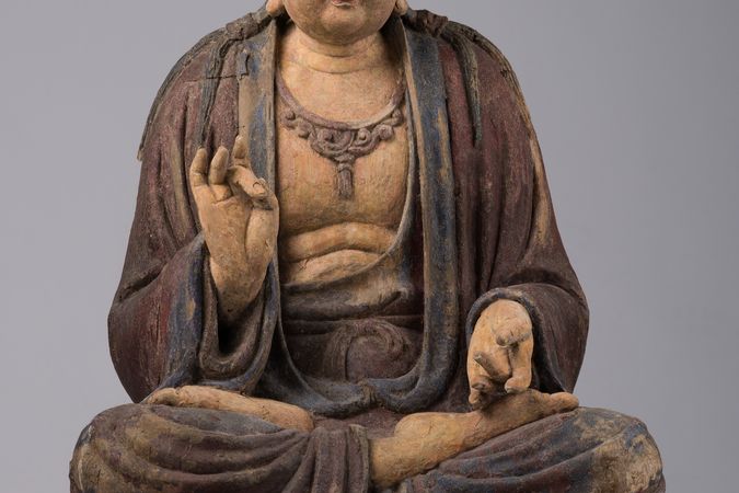 Bodhisattva assiso in vitarkamudrā