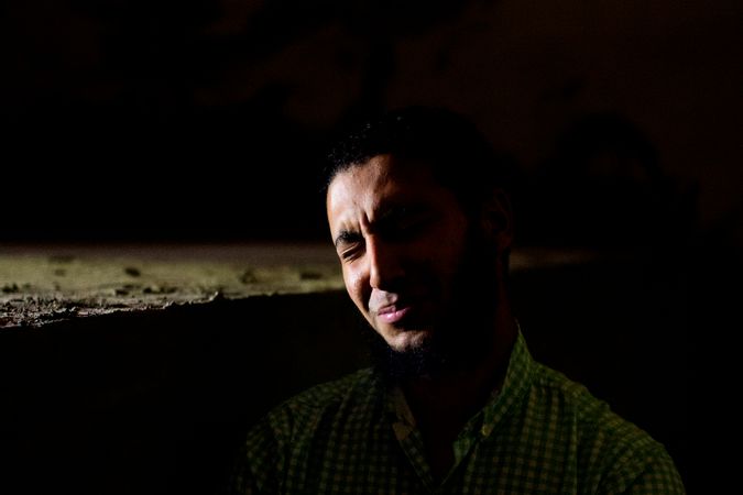 Abdul Rahman and Mohamed Samir, along with a group of Salafi friends pray at the Mansoura Islamic cemetary at night