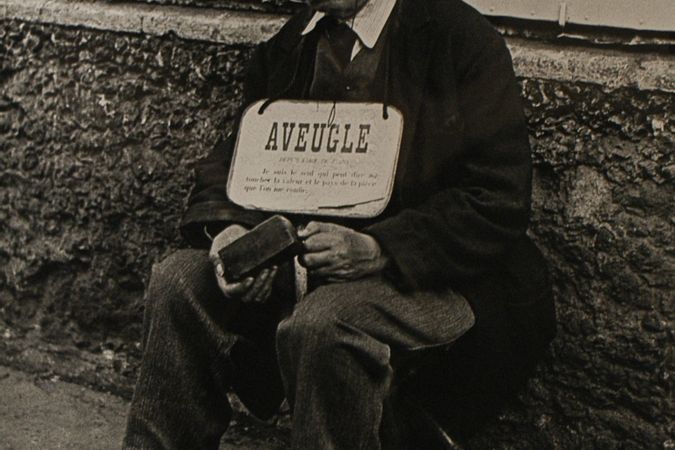 Blind Man in Front of Billboards