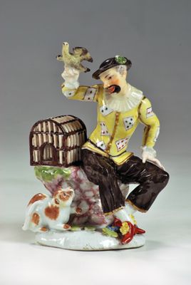 Arlecchino gioca con un uccello e con un gatto