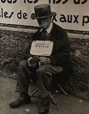 Blind Man in Front of Billboards